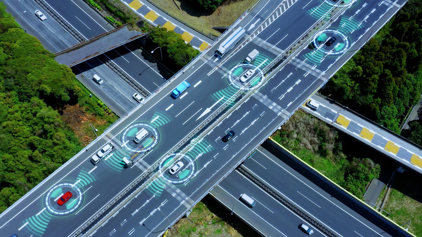 Aerial view of a highway with cars utilizing ADAS technology