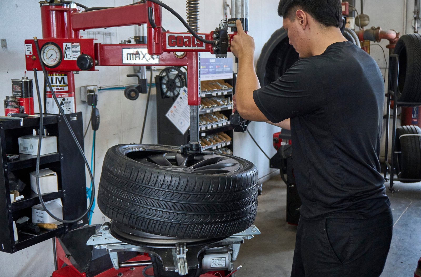 Tire technician mounting a Tesla tire