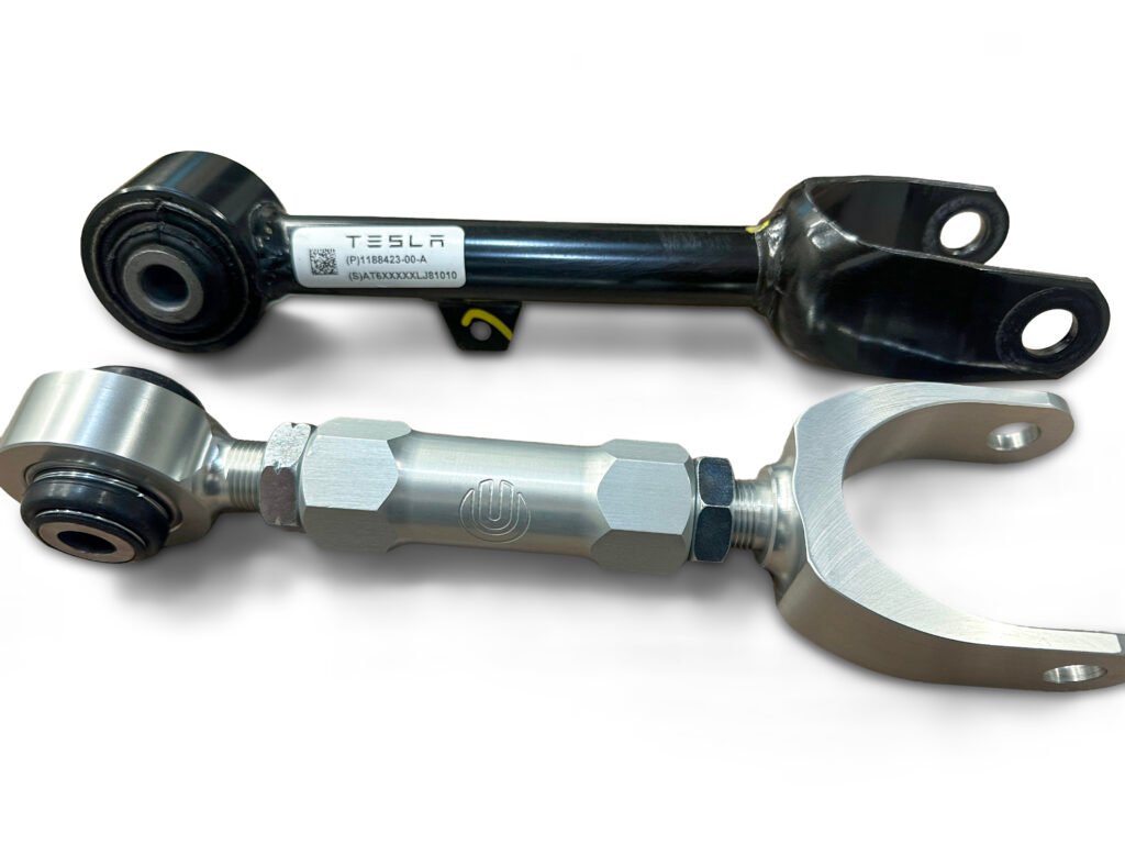 Unplugged Performance adjustable rear camber arms compared to stock Tesla OEM rear suspension arms, showing how camber can be modified to reduce inner tire wear.